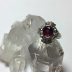 Choice oval ruby in platinum ring set with diamonds